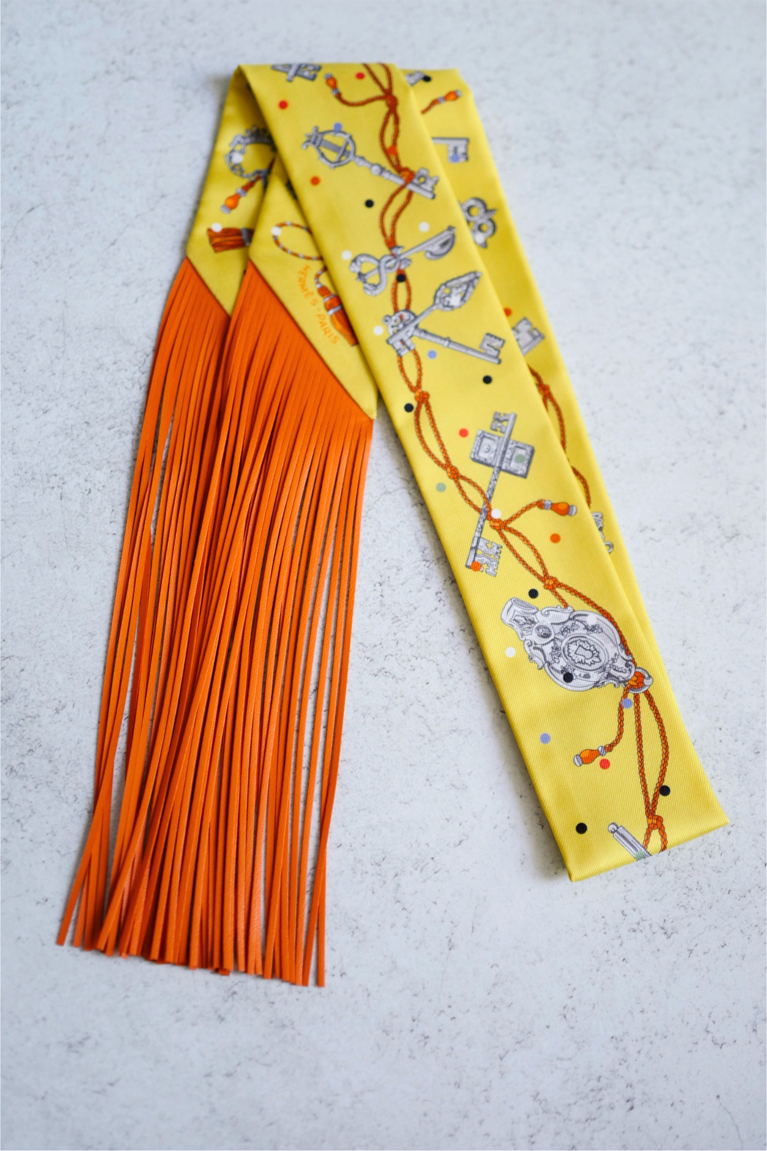 Hermès Twilly Les Cles a Pois Leather Fringes Jaune/Argent /Orange vif Silk
