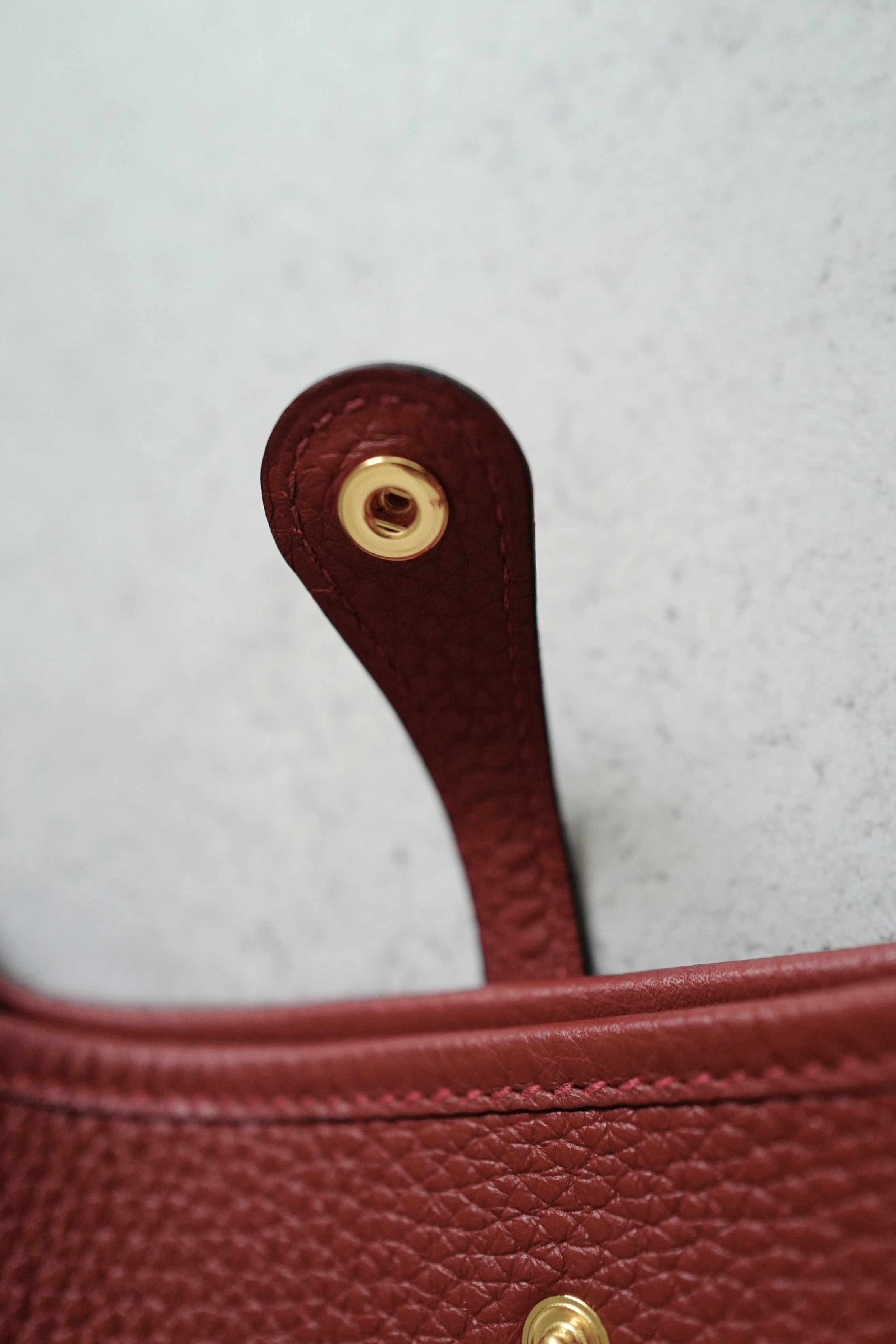 Hermès Mini Evelyne TPM Bag in Rouge H Clemence Leather with Gold Hardware