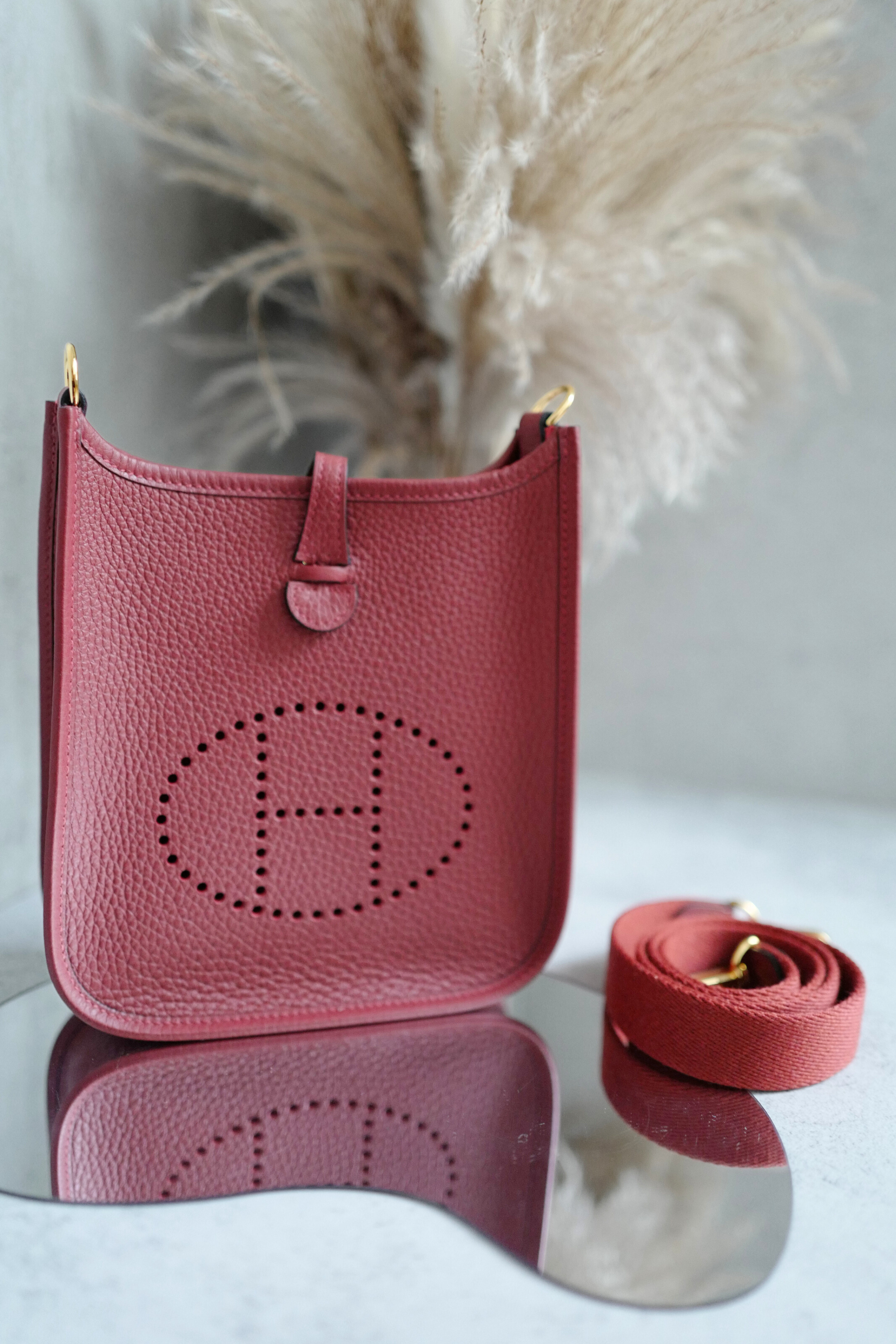 Hermès Mini Evelyne TPM Bag in Rouge H Clemence Leather with Gold Hardware