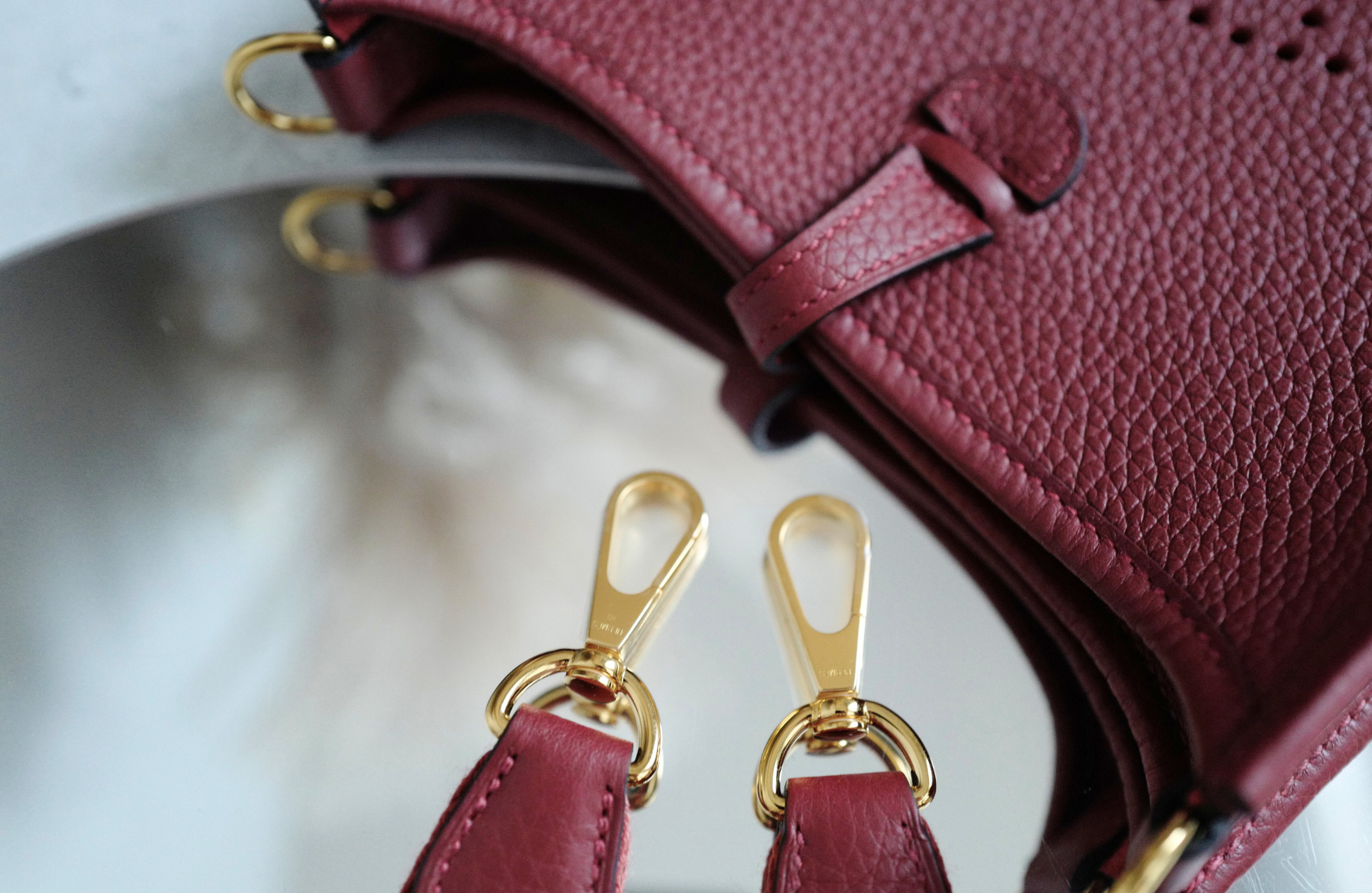 Hermès Mini Evelyne TPM Bag in Rouge H Clemence Leather with Gold Hardware