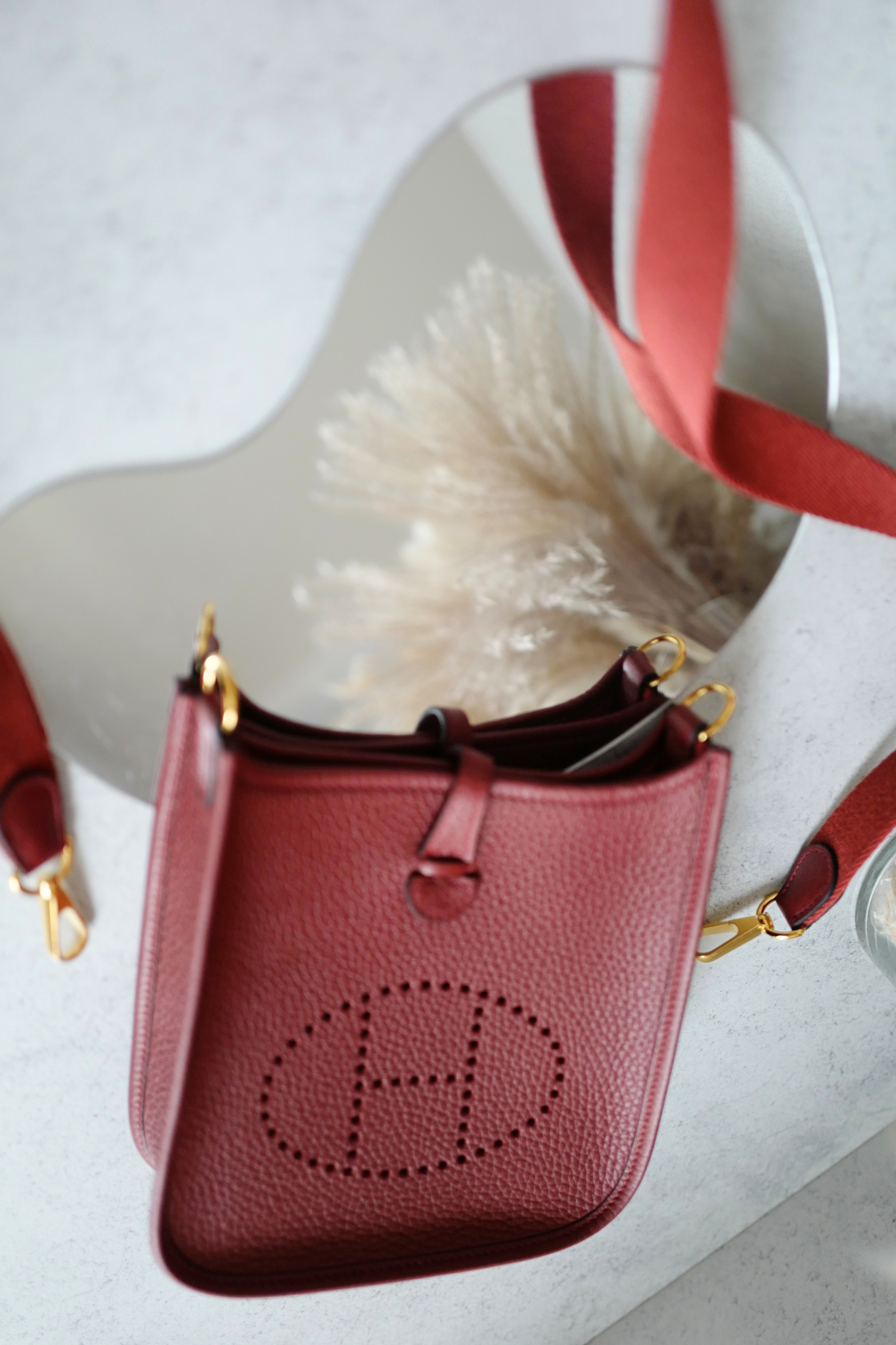 Hermès Mini Evelyne TPM Bag in Rouge H Clemence Leather with Gold Hardware