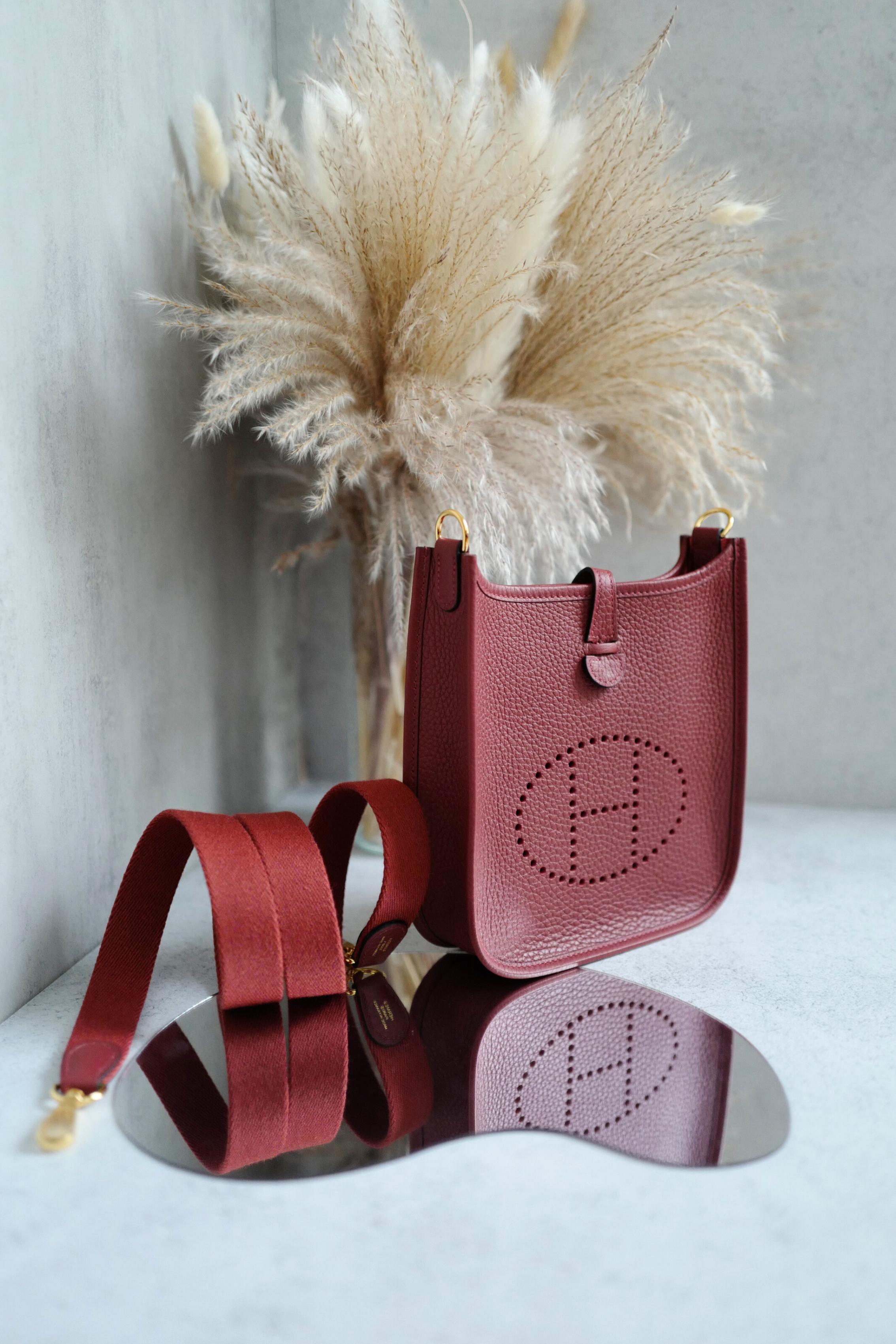 Hermès Mini Evelyne TPM Bag in Rouge H Clemence Leather with Gold Hardware