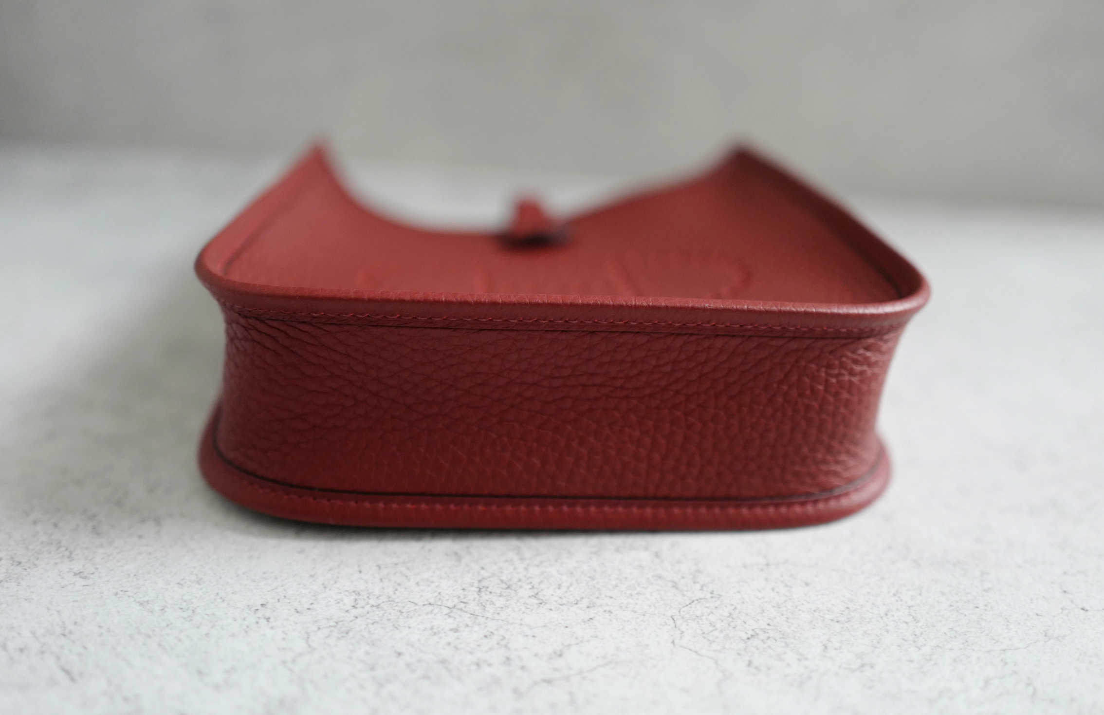 Hermès Mini Evelyne TPM Bag in Rouge H Clemence Leather with Gold Hardware