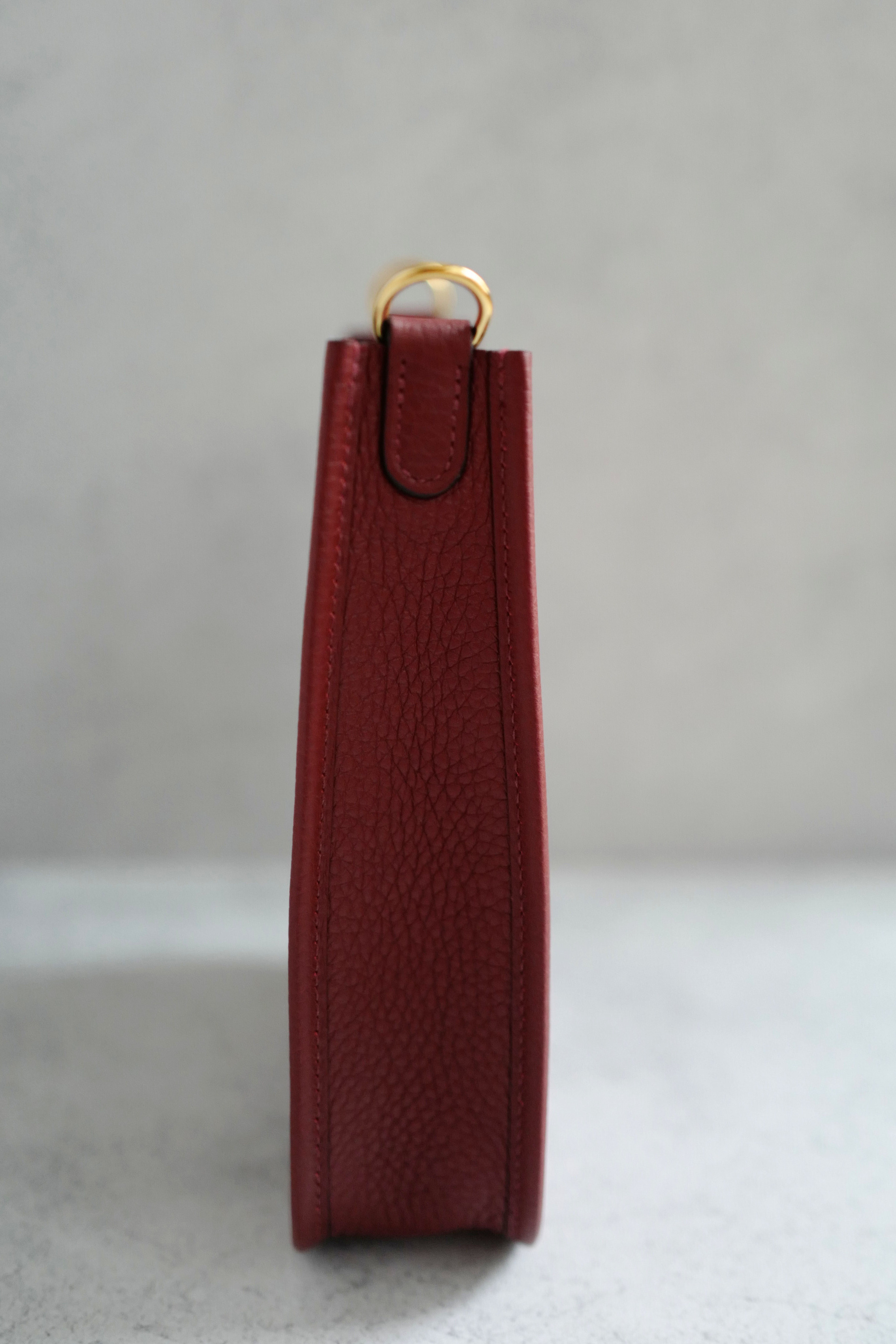 Hermès Mini Evelyne TPM Bag in Rouge H Clemence Leather with Gold Hardware