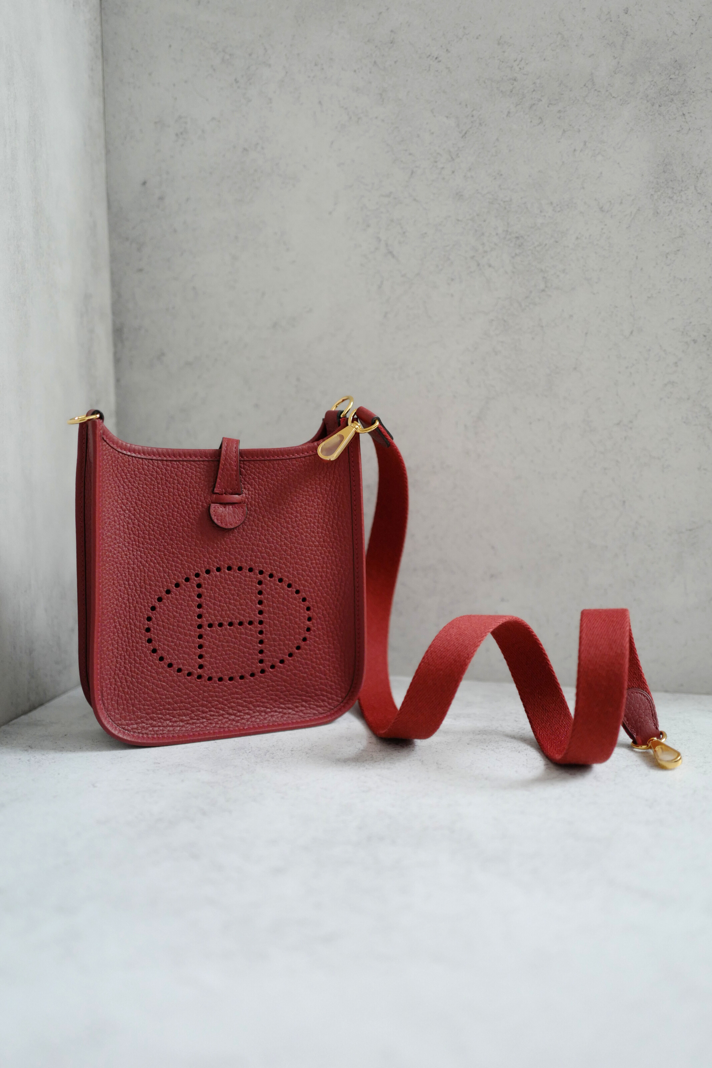 Hermès Mini Evelyne TPM Bag in Rouge H Clemence Leather with Gold Hardware