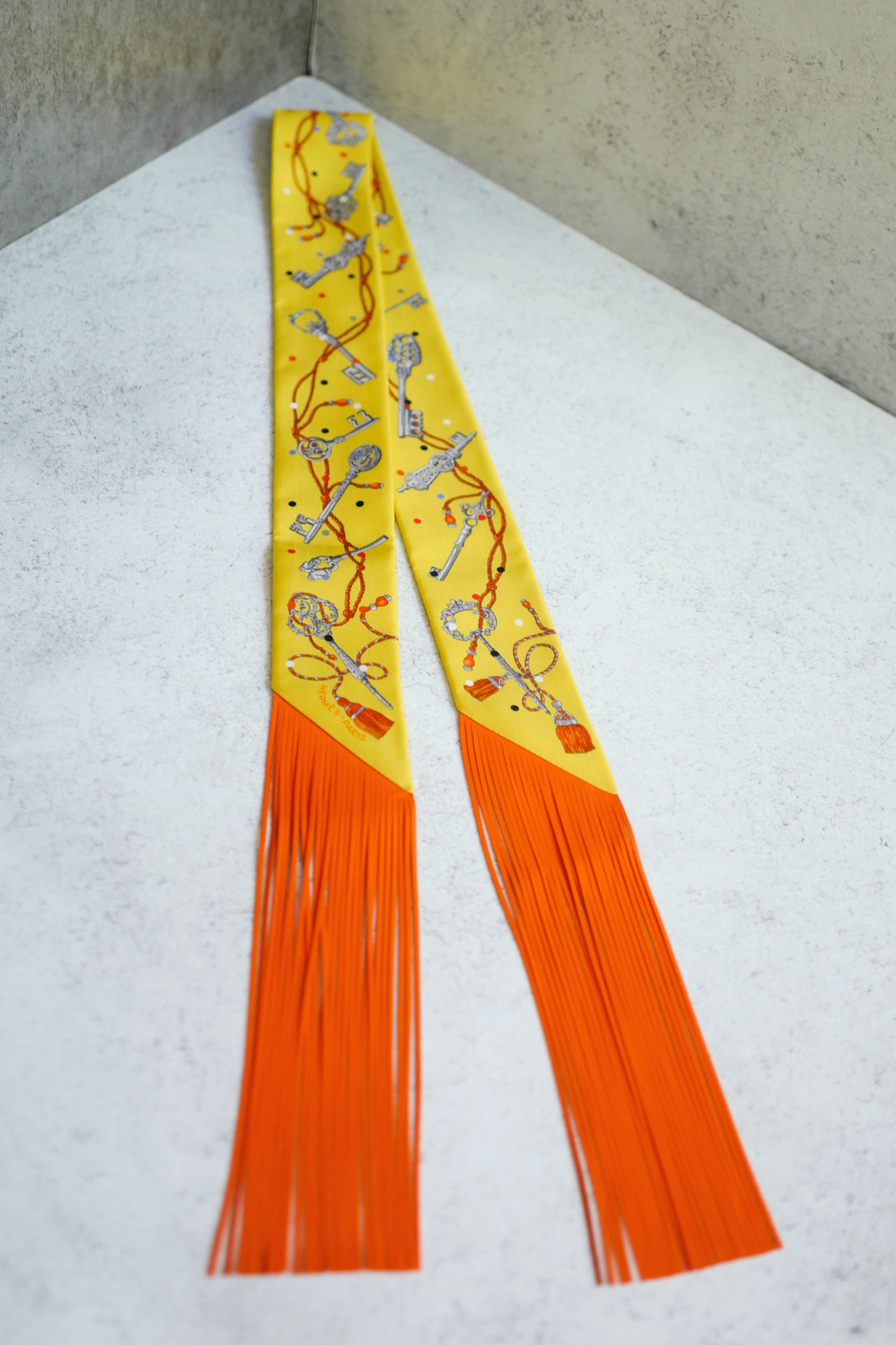 Hermès Twilly Les Cles a Pois Leather Fringes Jaune/Argent /Orange vif Silk