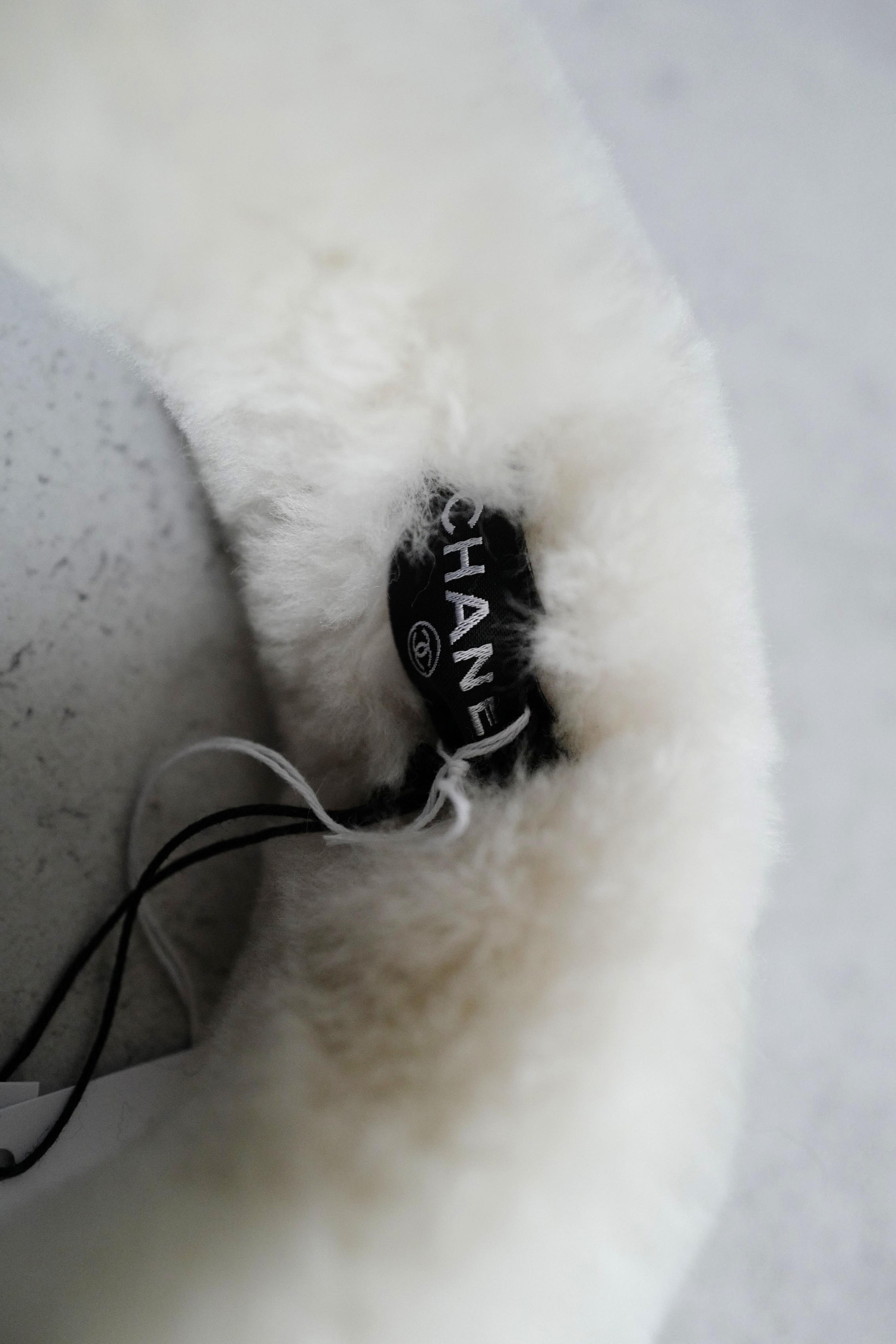 BNIB Chanel 25N Coco Neige Shearling Earmuffs in Black and White
