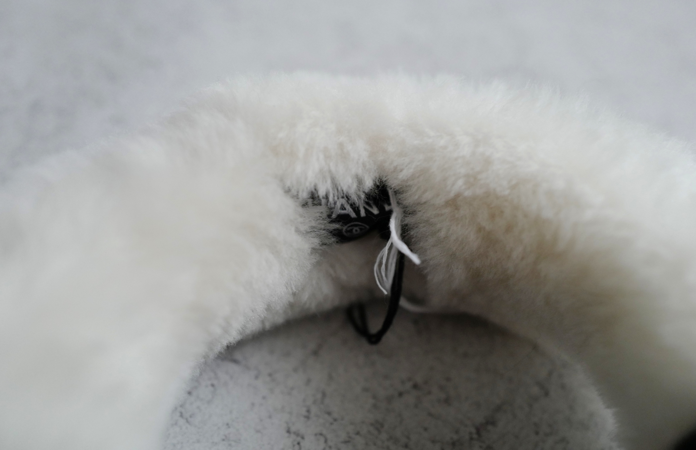 BNIB Chanel 25N Coco Neige Shearling Earmuffs in Black and White