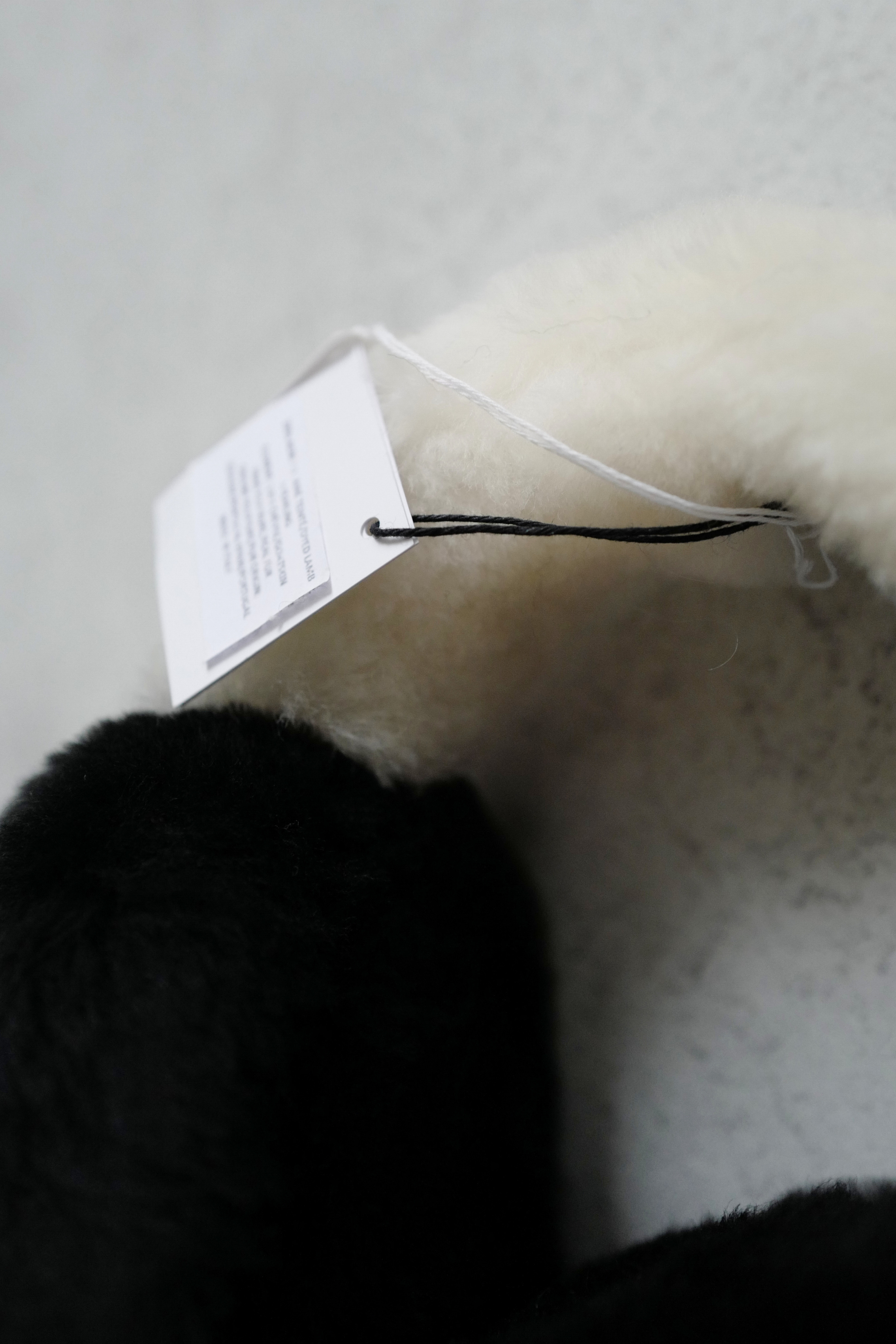 BNIB Chanel 25N Coco Neige Shearling Earmuffs in Black and White