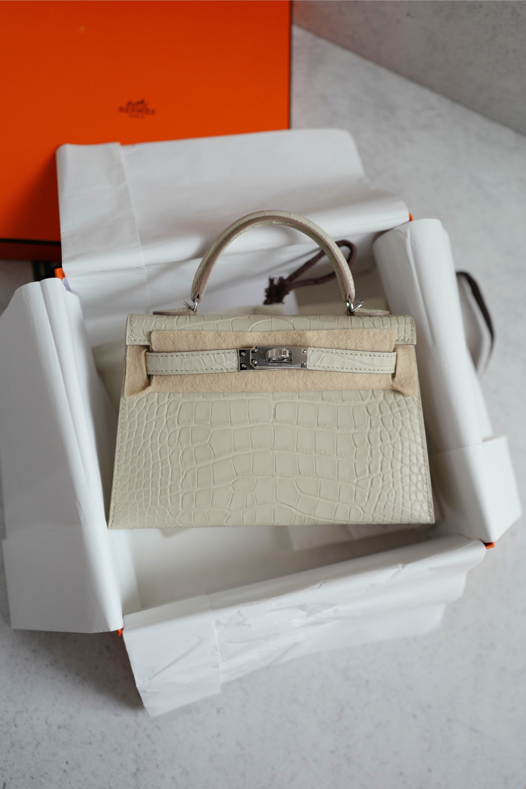BNIB Hermès Mini Kelly 20 Beton Matte Crocodile with Palladium Hardware Stamp K