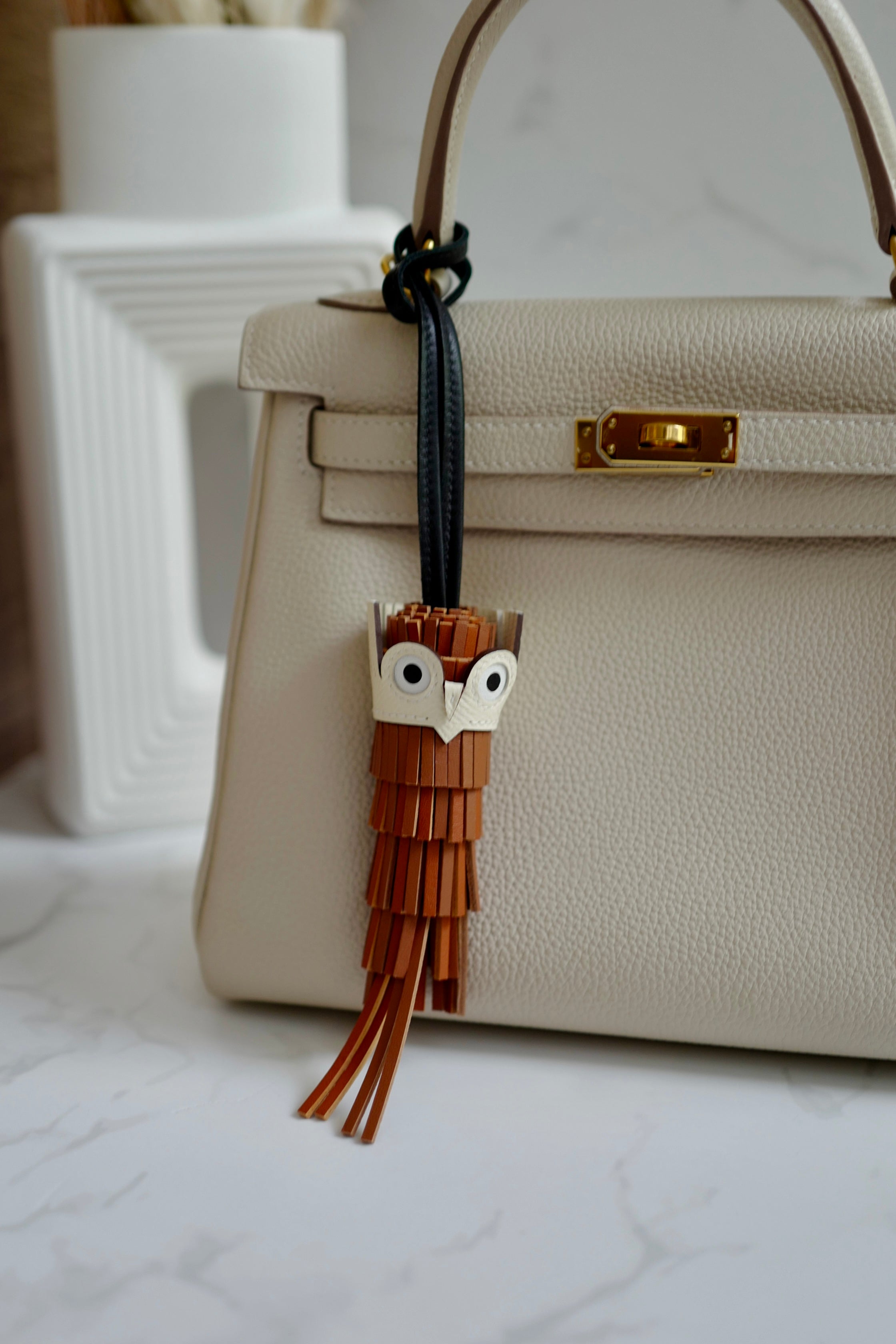 Brand New HERMÈS Chouette Charm Agneau Milo Swift in Gold / Pain d'épice / Noir