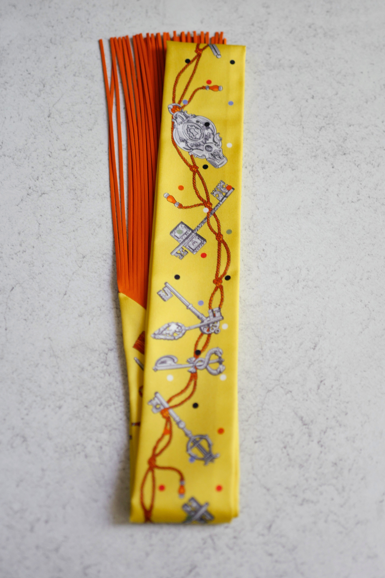 Hermès Twilly Les Cles a Pois Leather Fringes Jaune/Argent /Orange vif Silk
