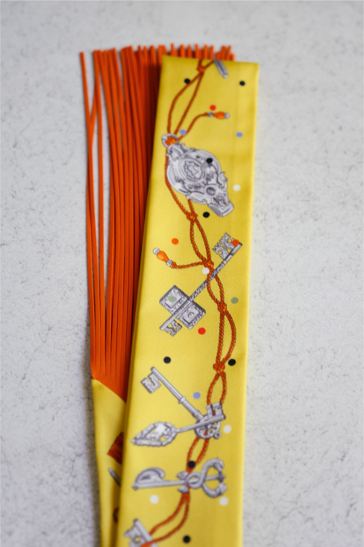 Hermès Twilly Les Cles a Pois Leather Fringes Jaune/Argent /Orange vif Silk