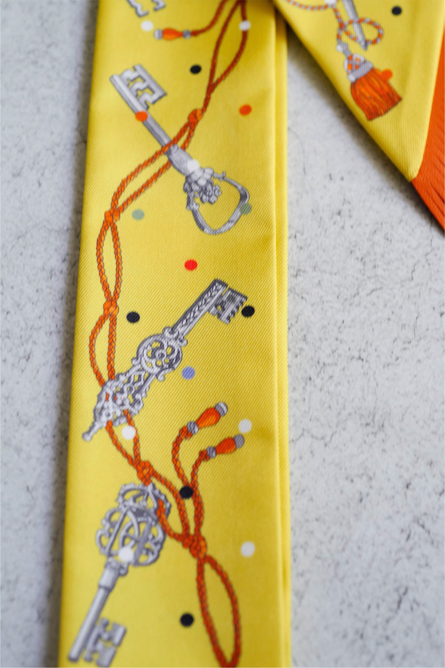 Hermès Twilly Les Cles a Pois Leather Fringes Jaune/Argent /Orange vif Silk