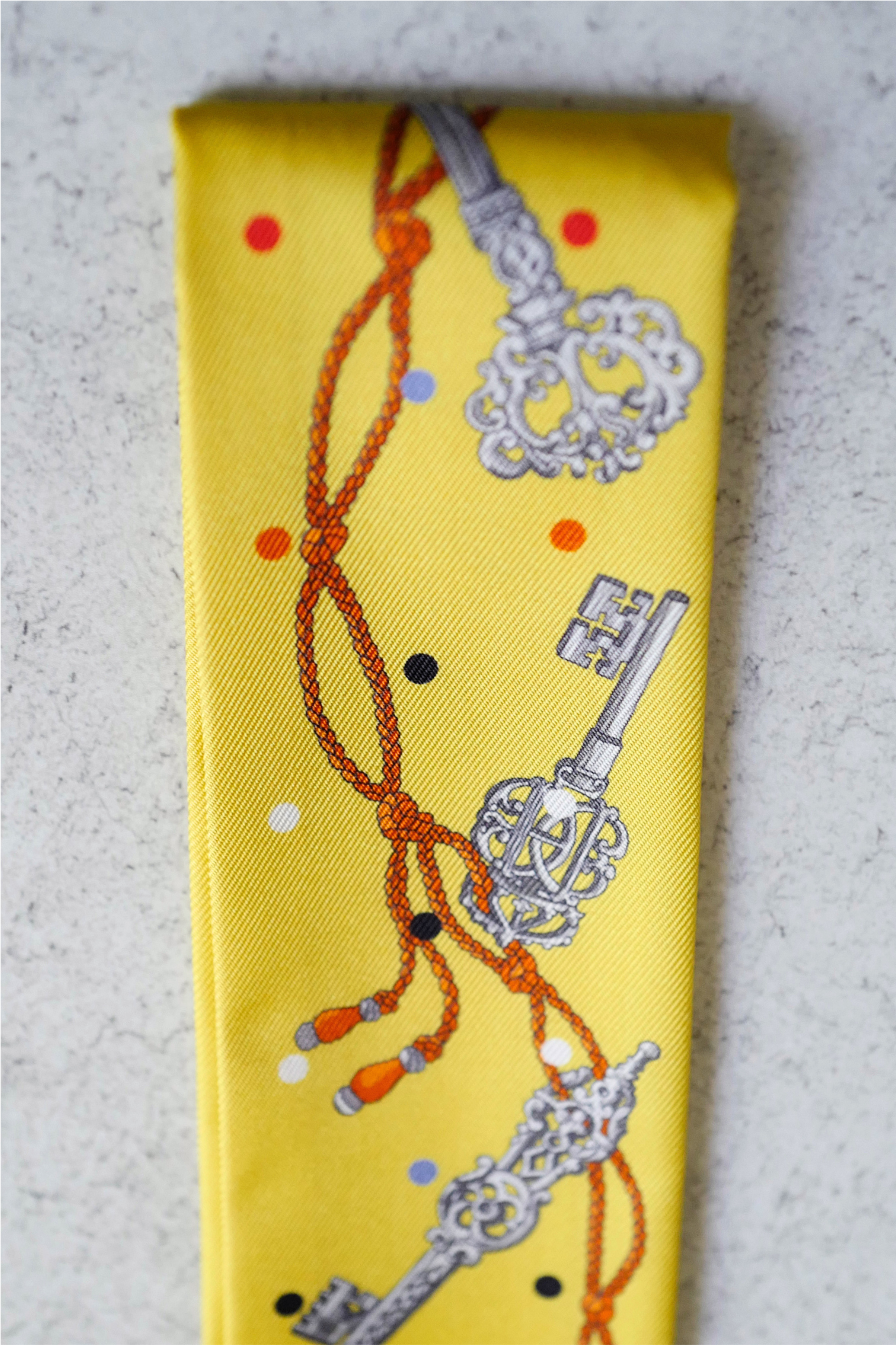 Hermès Twilly Les Cles a Pois Leather Fringes Jaune/Argent /Orange vif Silk