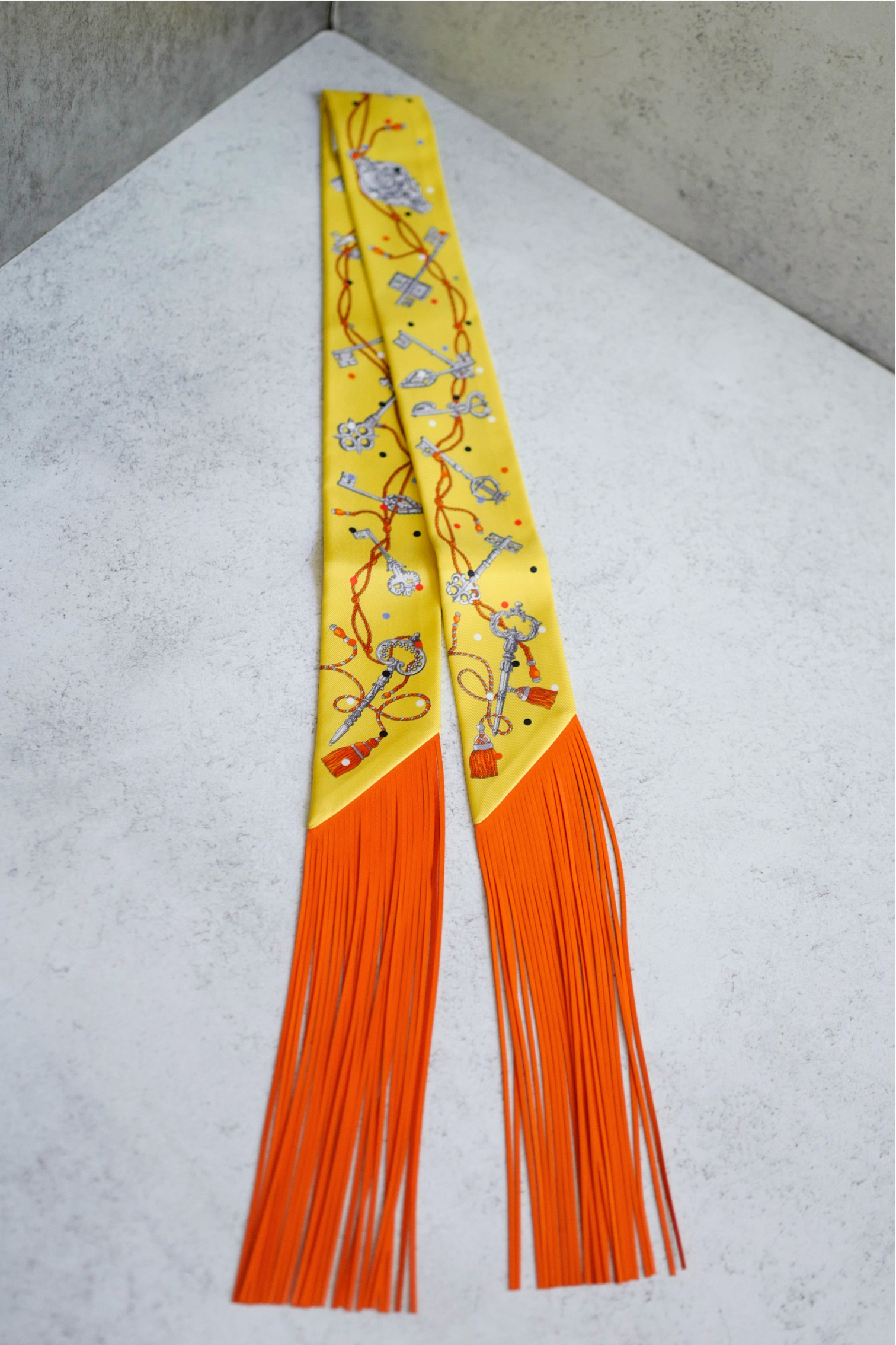 Hermès Twilly Les Cles a Pois Leather Fringes Jaune/Argent /Orange vif Silk