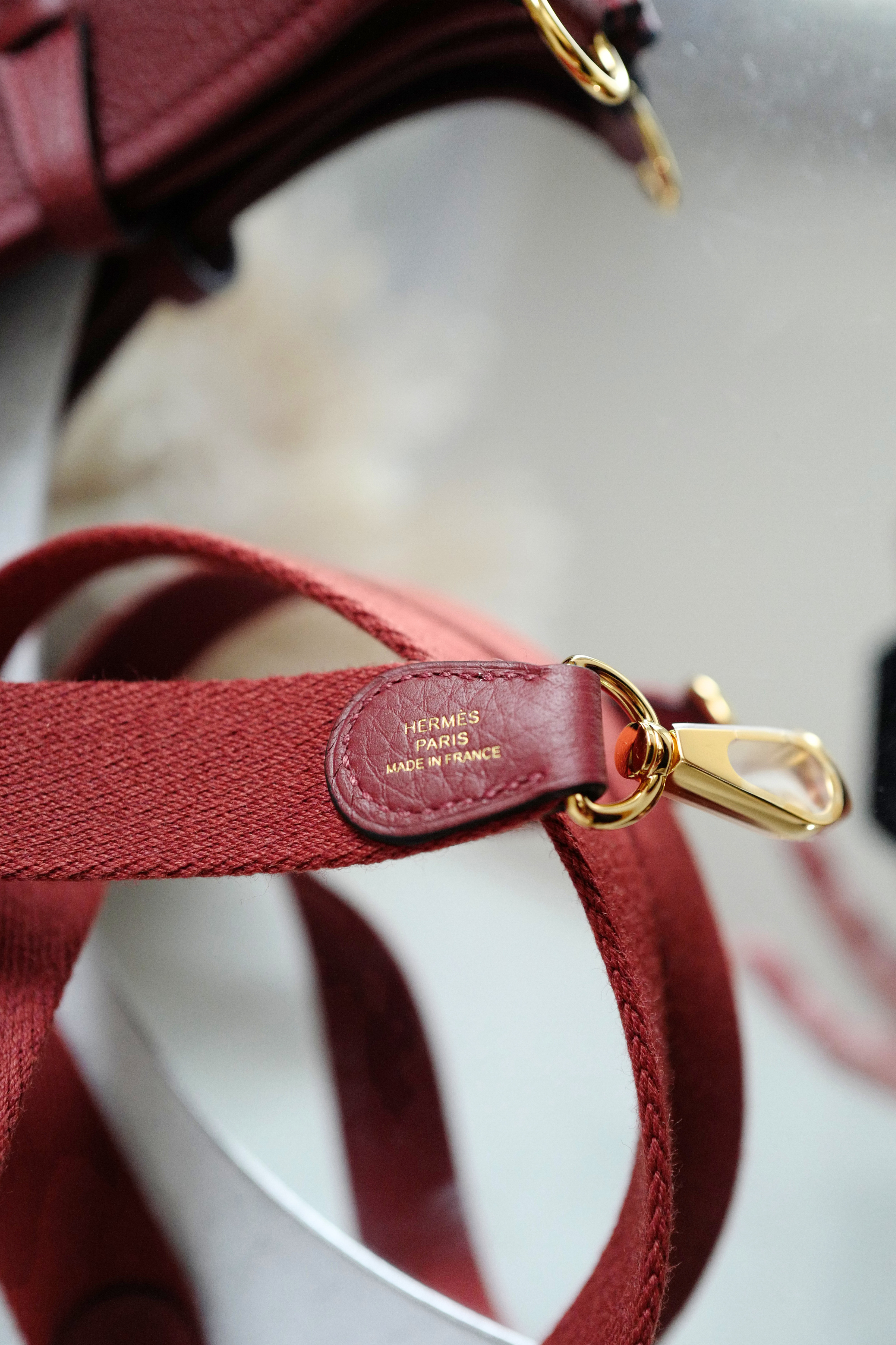 Hermès Mini Evelyne TPM Bag in Rouge H Clemence Leather with Gold Hardware