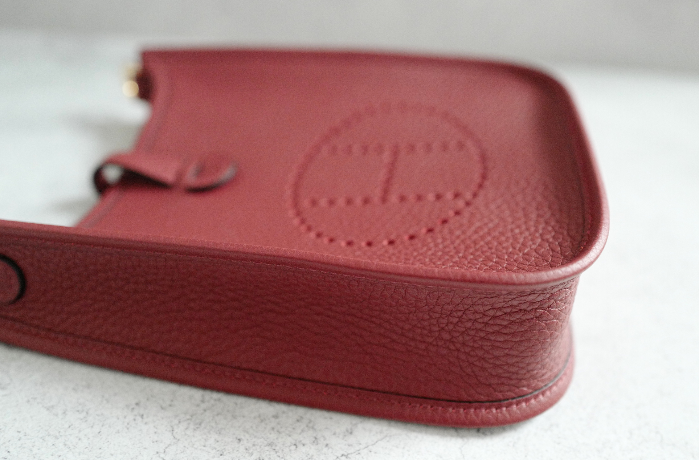 Hermès Mini Evelyne TPM Bag in Rouge H Clemence Leather with Gold Hardware