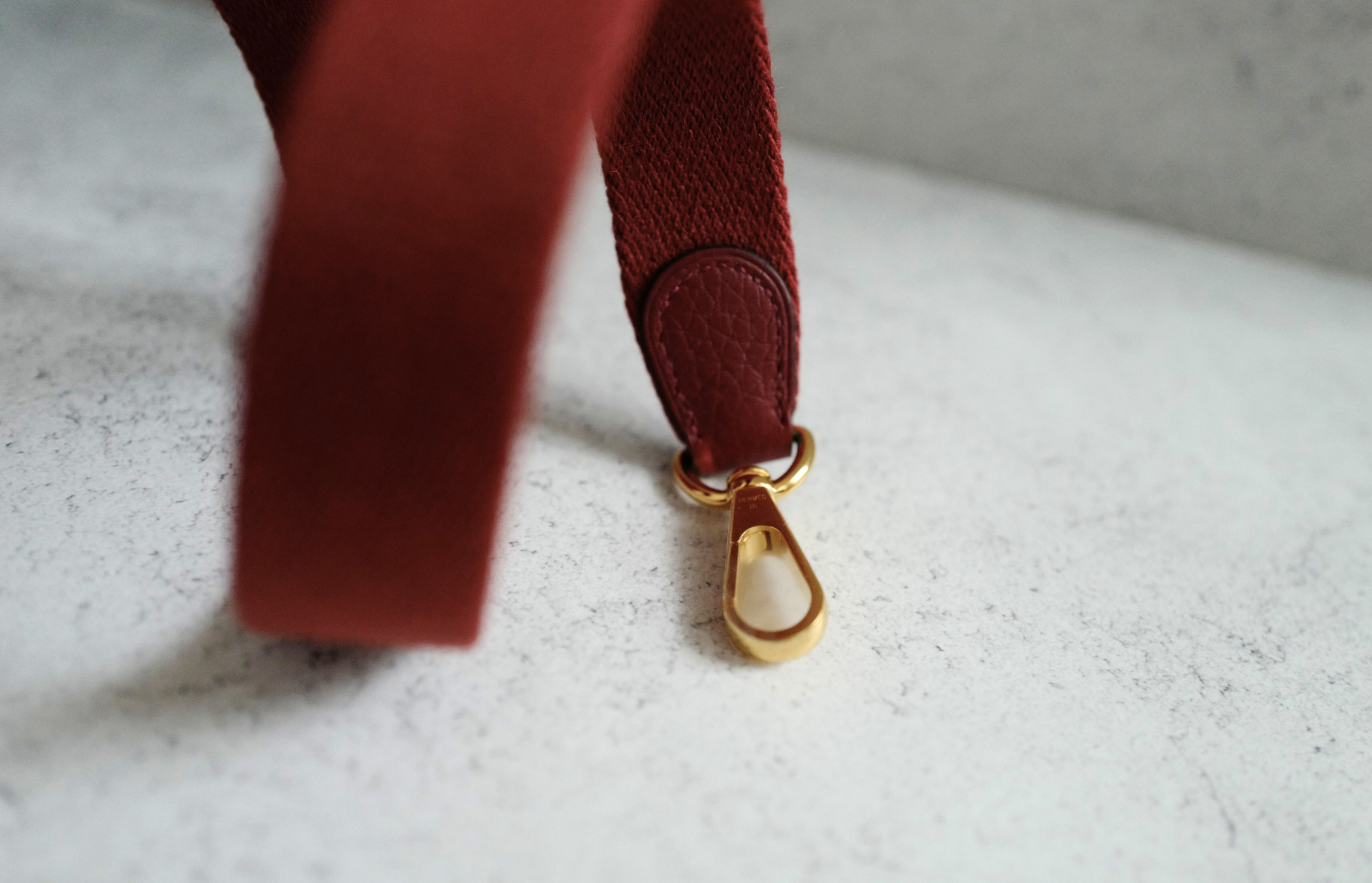 Hermès Mini Evelyne TPM Bag in Rouge H Clemence Leather with Gold Hardware