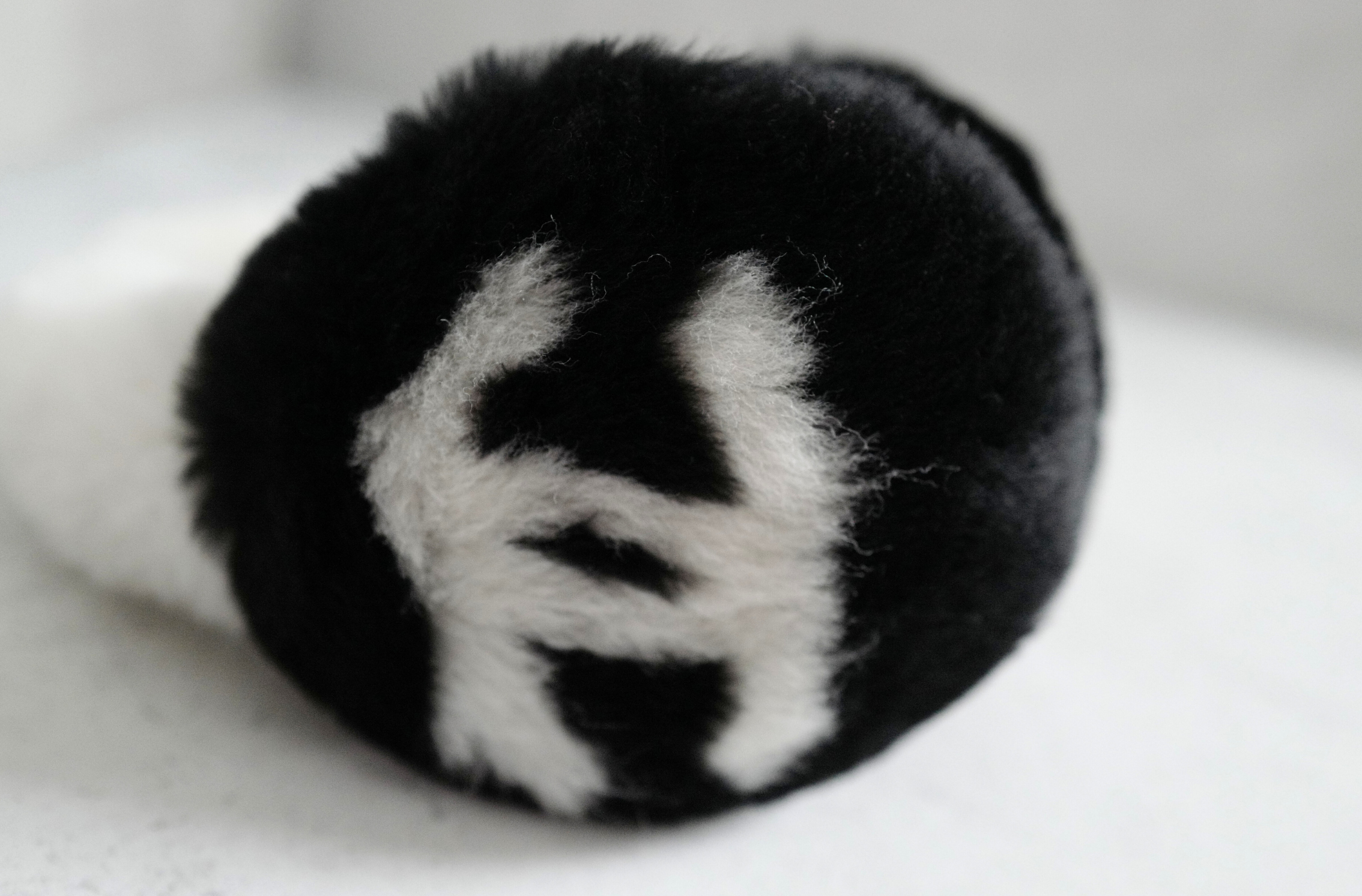 BNIB Chanel 25N Coco Neige Shearling Earmuffs in Black and White