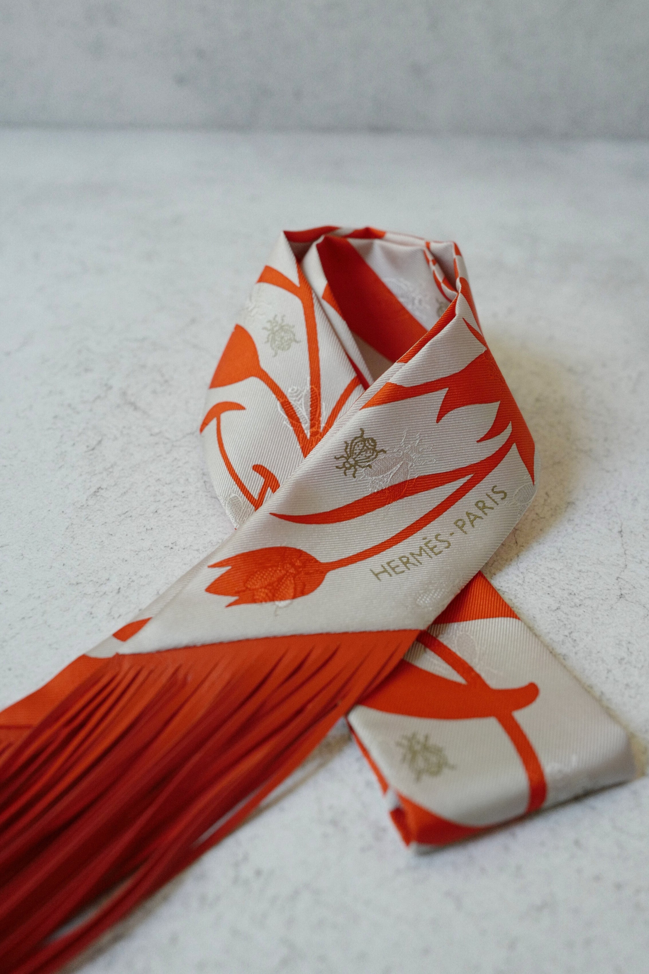 Hermès Twilly Bouquet Final Silk Gris Perle Vermillon with Leather Fringe