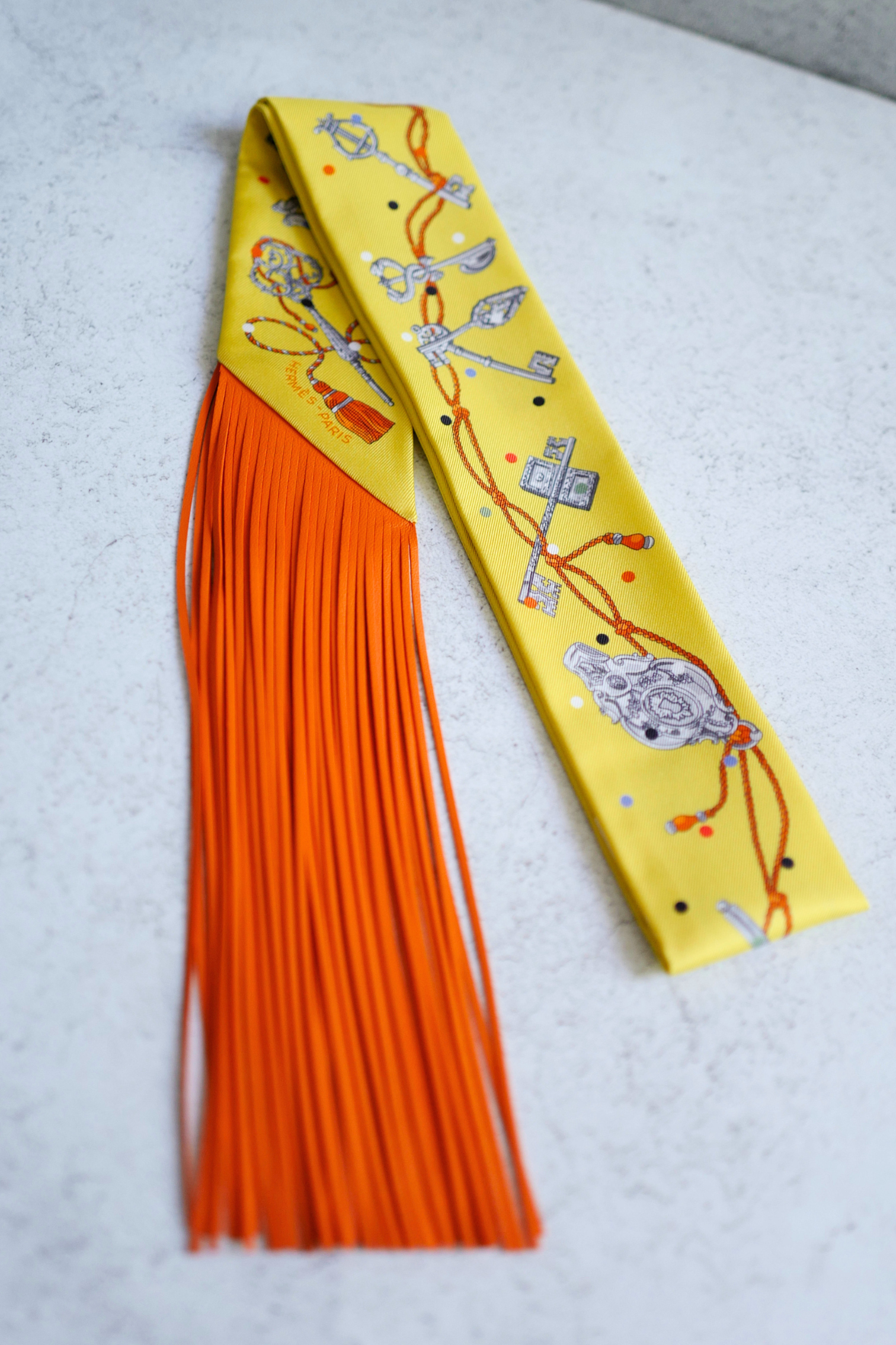Hermès Twilly Les Cles a Pois Leather Fringes Jaune/Argent /Orange vif Silk