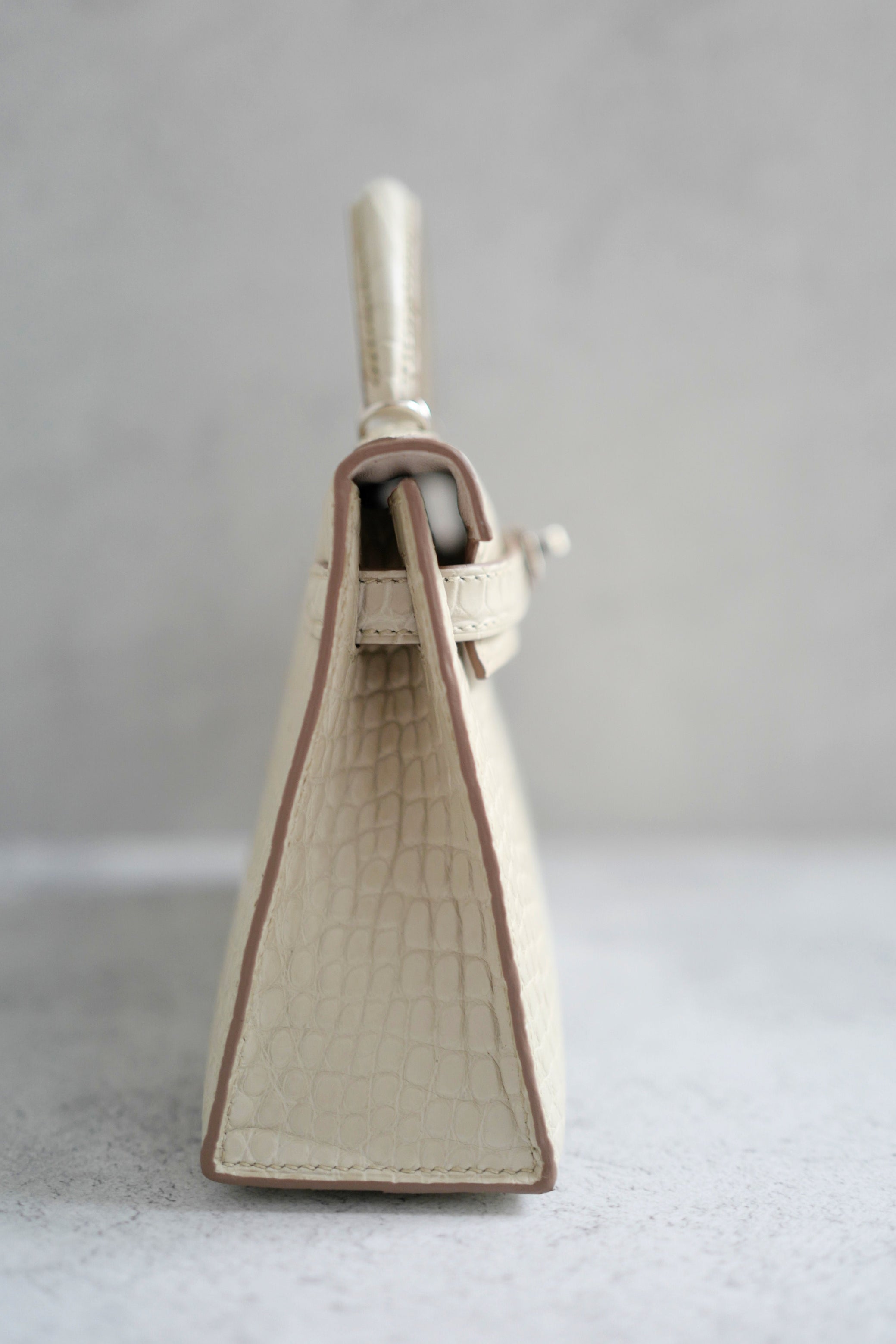 BNIB Hermès Mini Kelly 20 Beton Matte Crocodile with Palladium Hardware Stamp K