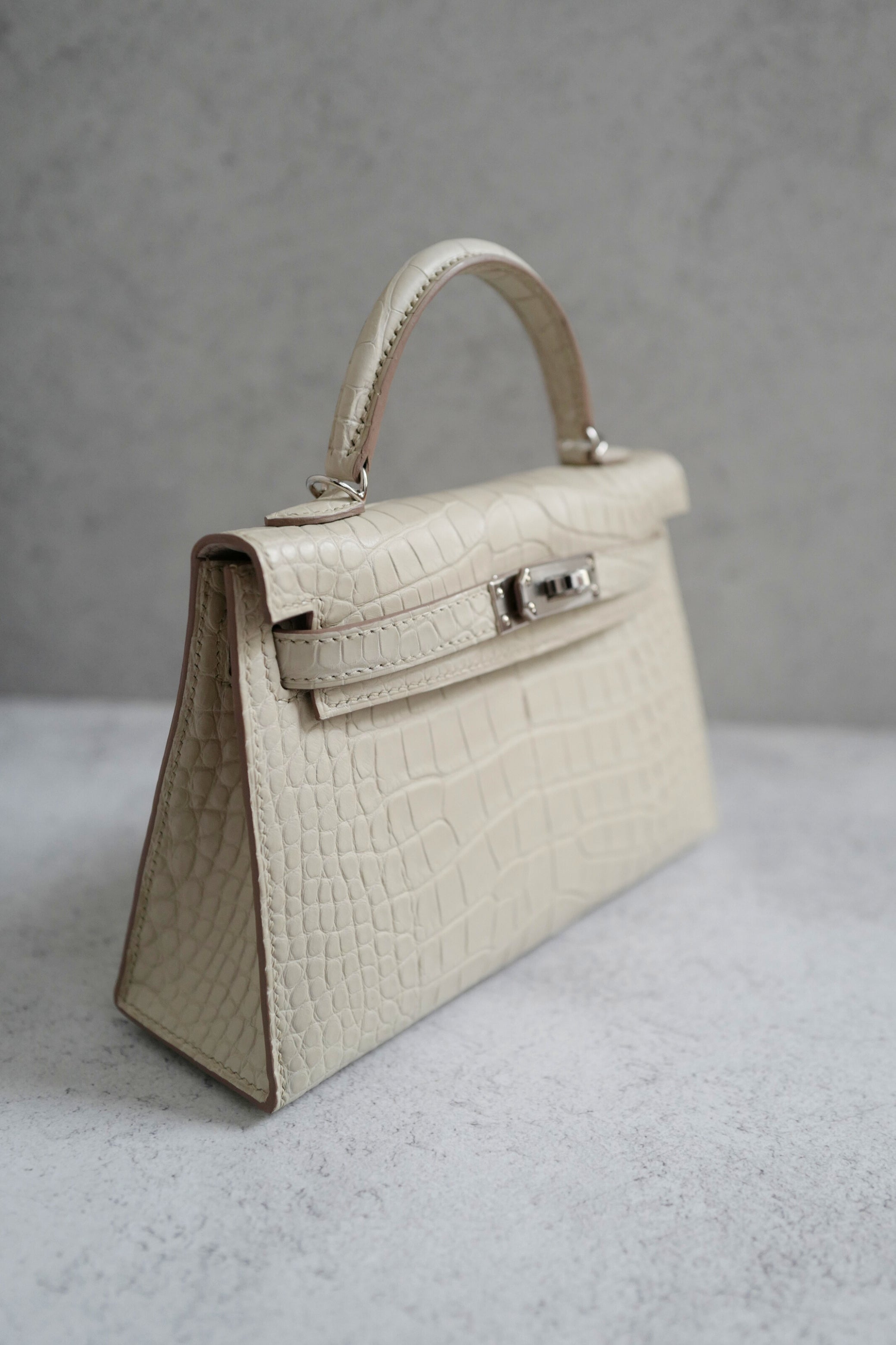 BNIB Hermès Mini Kelly 20 Beton Matte Crocodile with Palladium Hardware Stamp K