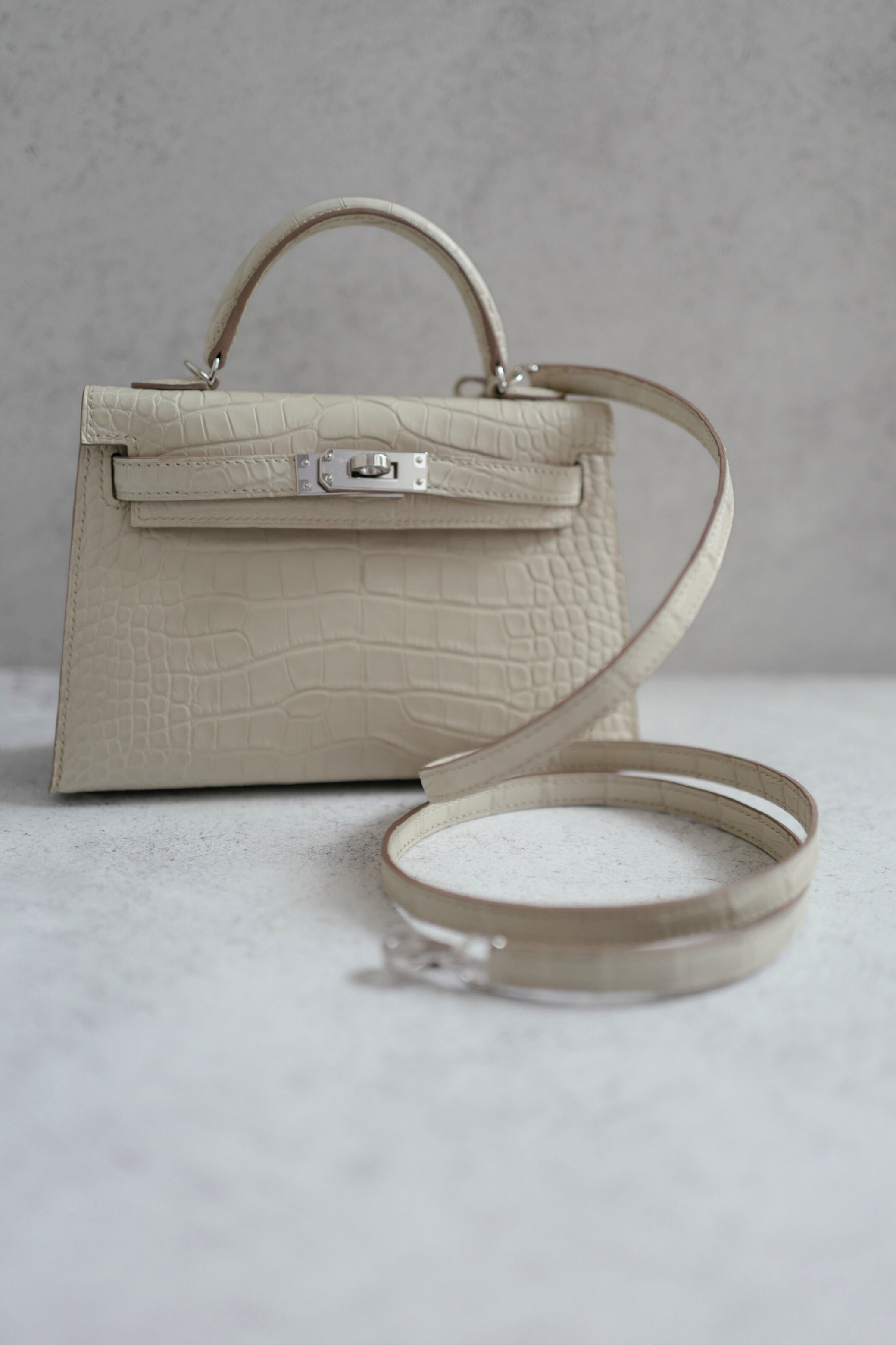 BNIB Hermès Mini Kelly 20 Beton Matte Crocodile with Palladium Hardware Stamp K