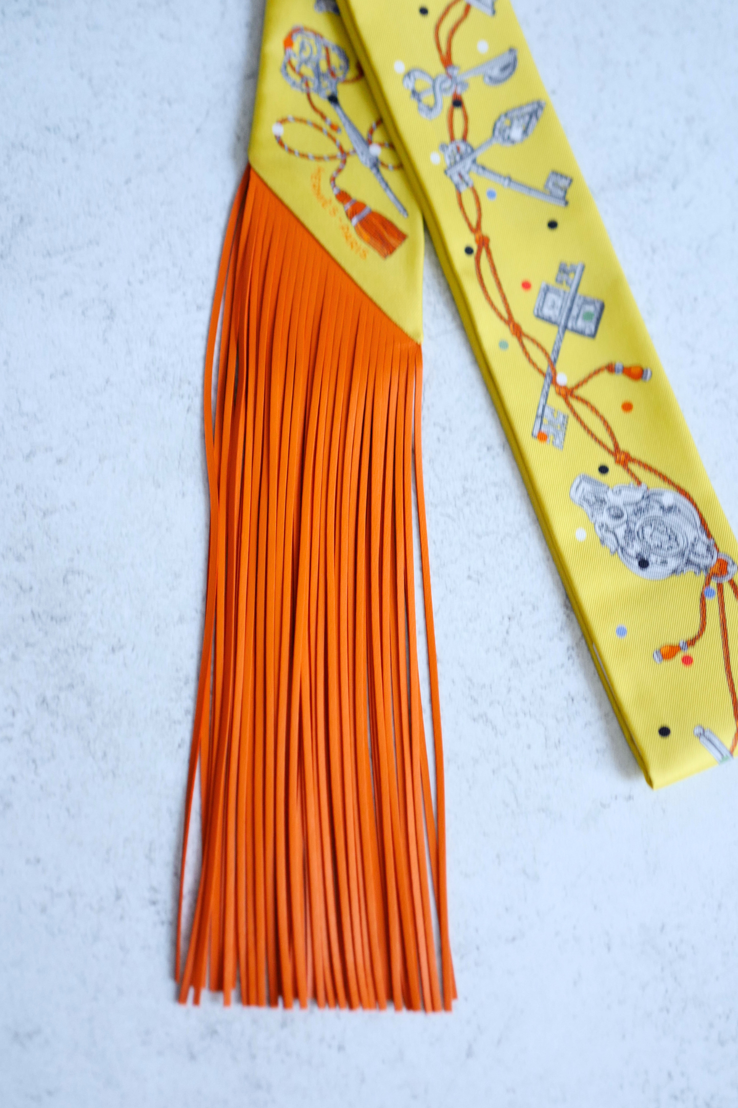 Hermès Twilly Les Cles a Pois Leather Fringes Jaune/Argent /Orange vif Silk