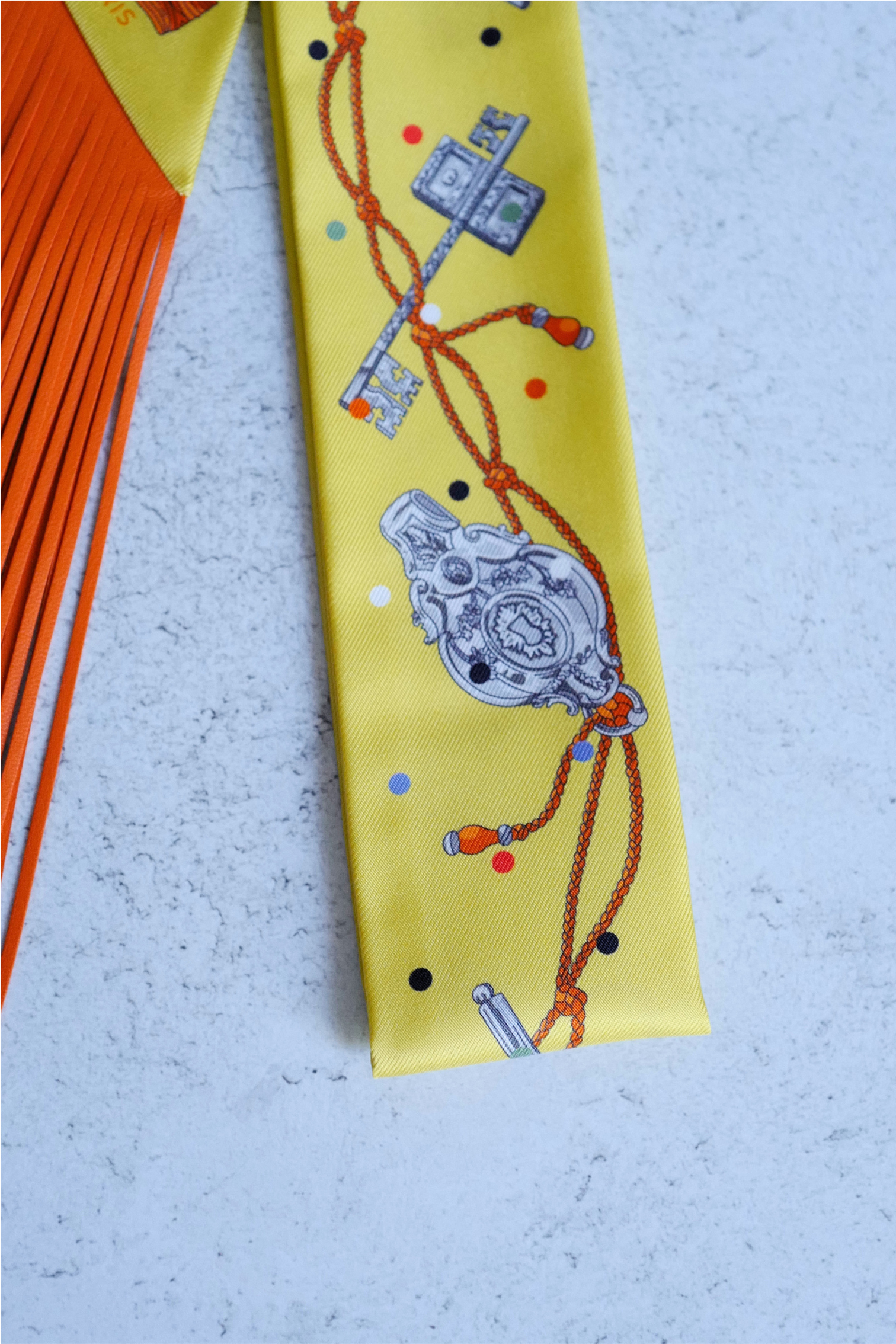 Hermès Twilly Les Cles a Pois Leather Fringes Jaune/Argent /Orange vif Silk