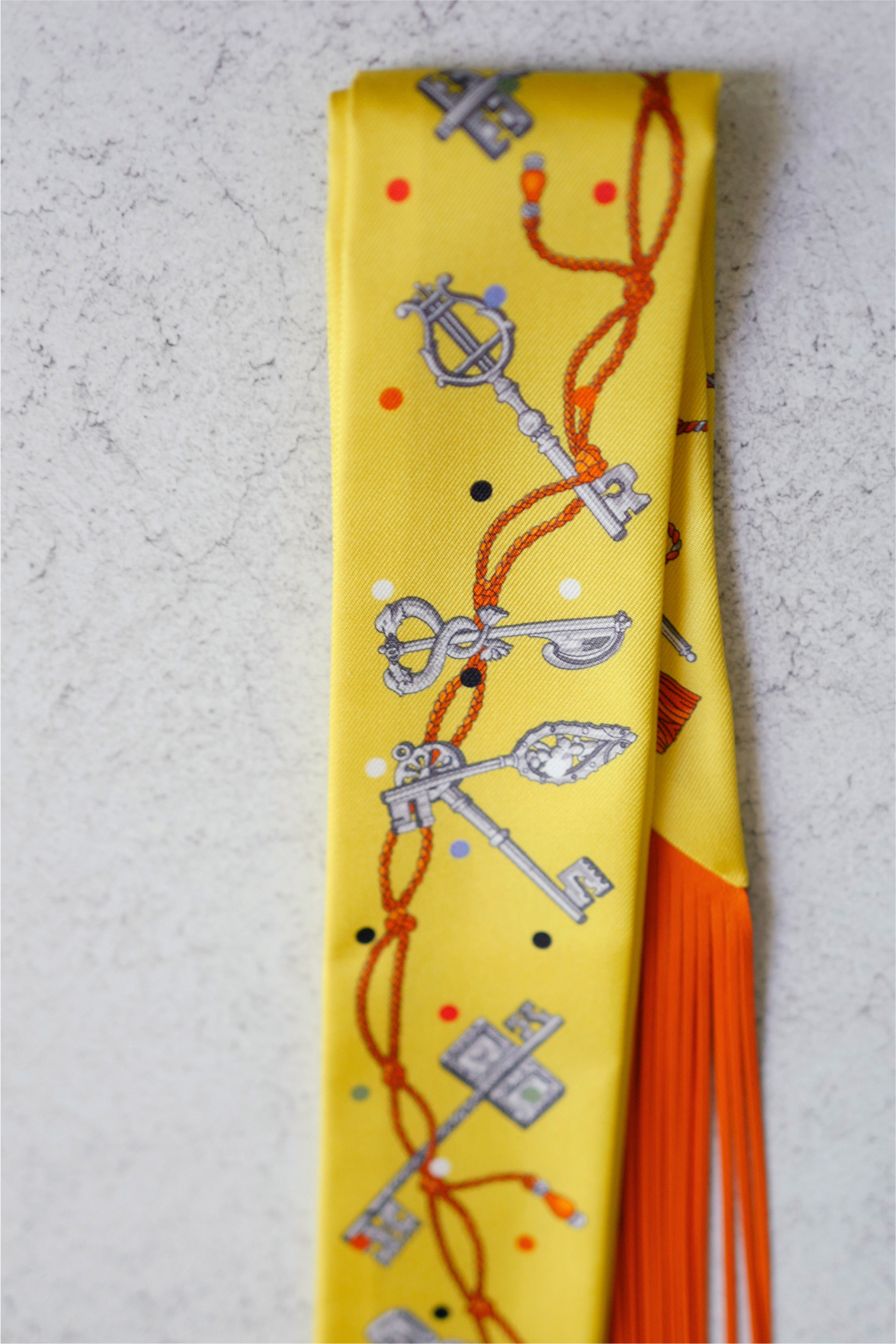 Hermès Twilly Les Cles a Pois Leather Fringes Jaune/Argent /Orange vif Silk